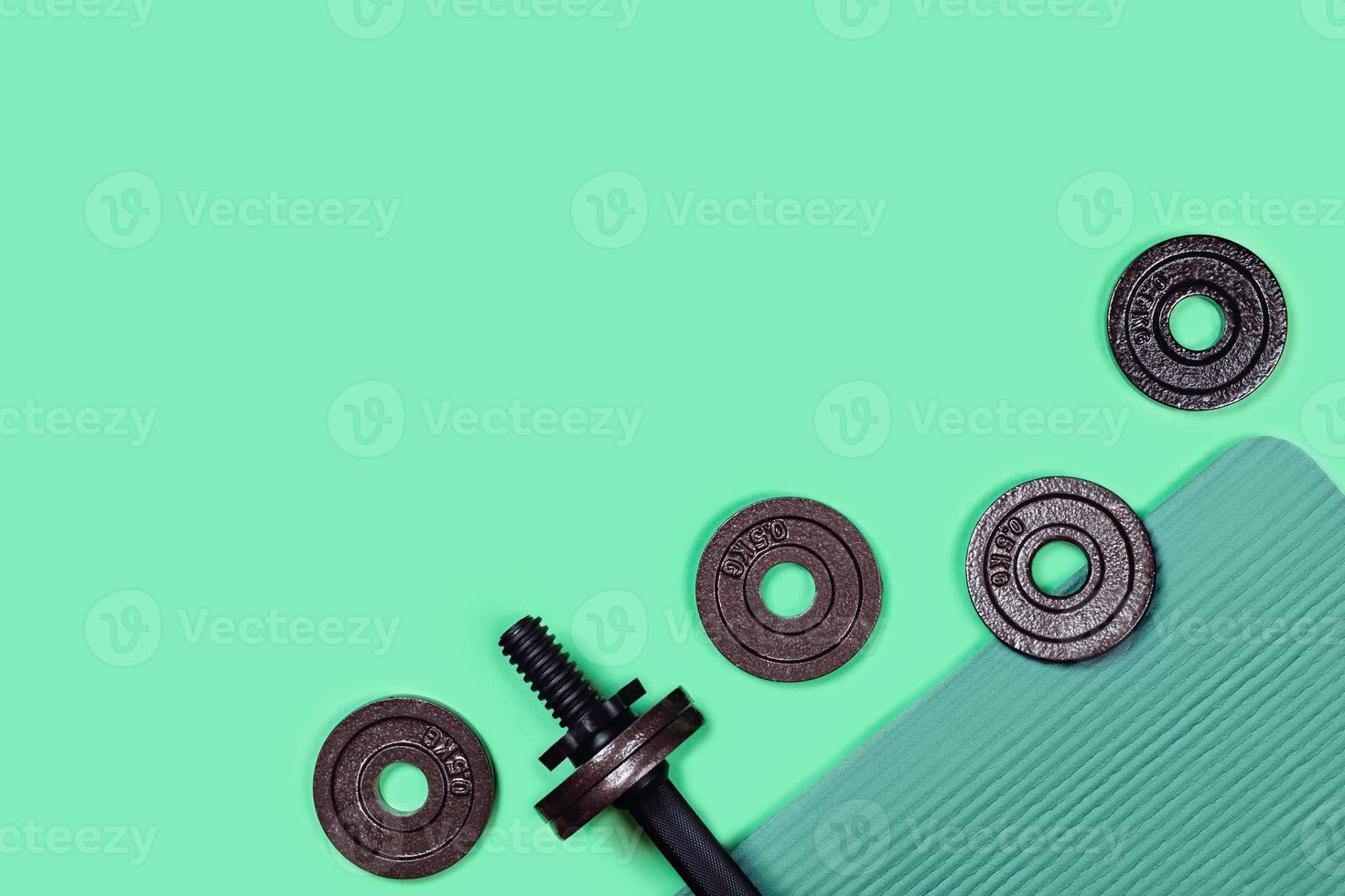 Dumbbell on color background. photo