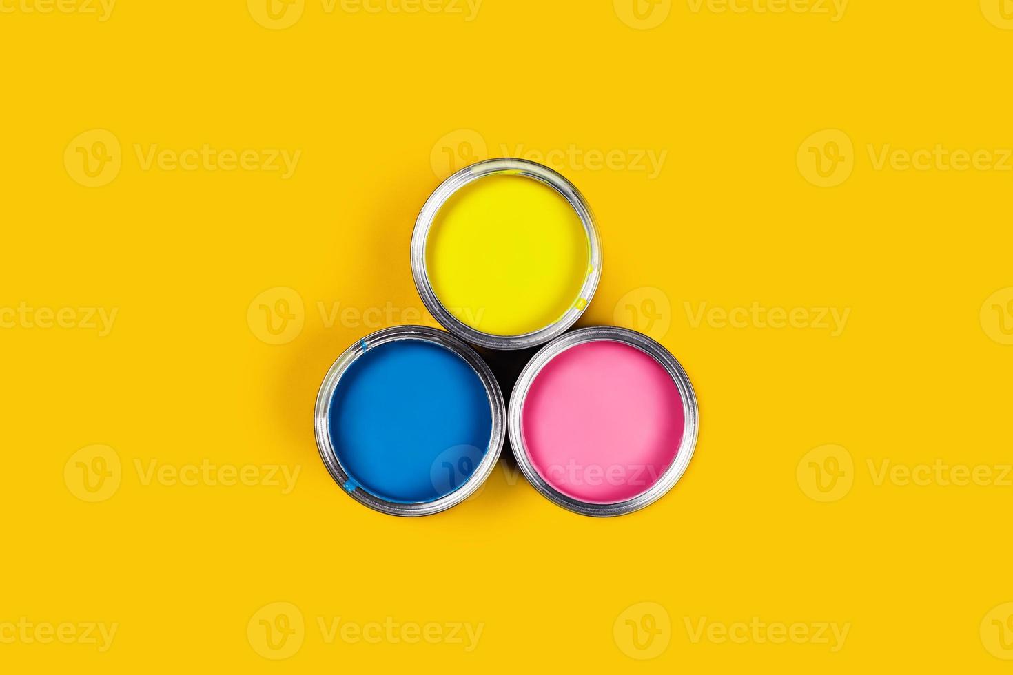 Colored background with paint jars. photo