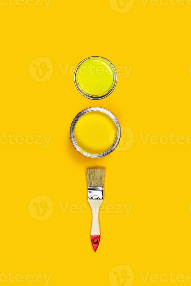 Colored background with paint jar and brush. photo