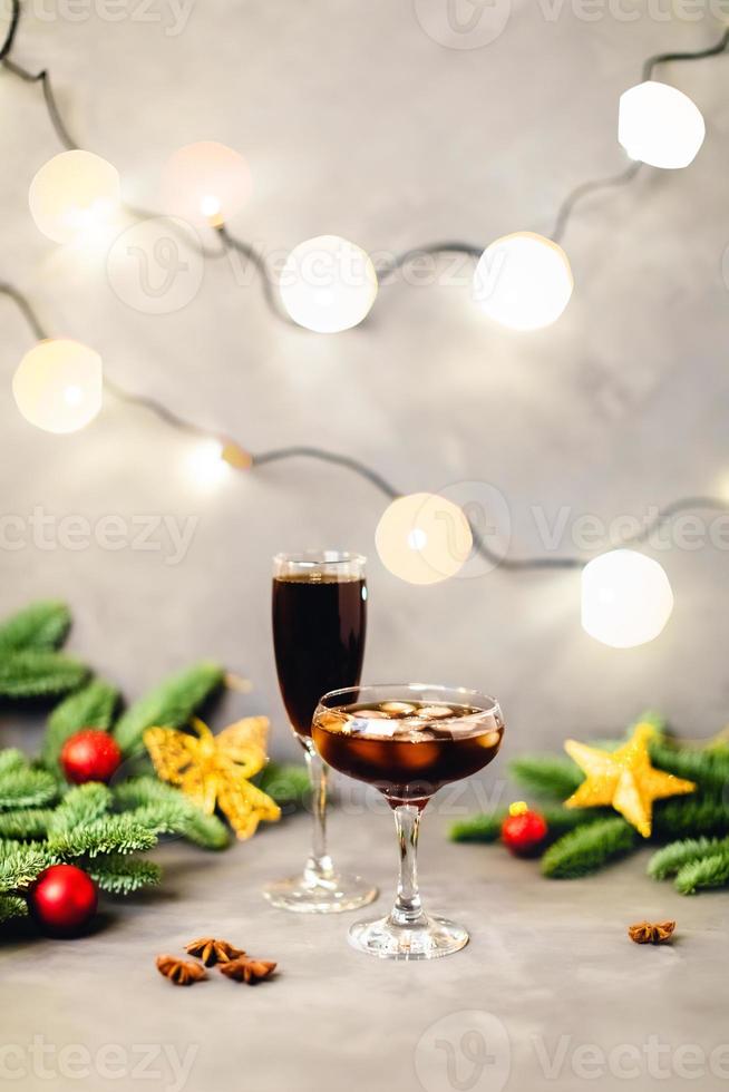 Christmas composition with lights and glasses. photo