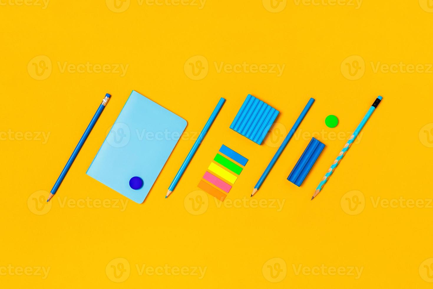 School supplies on a yellow background. photo