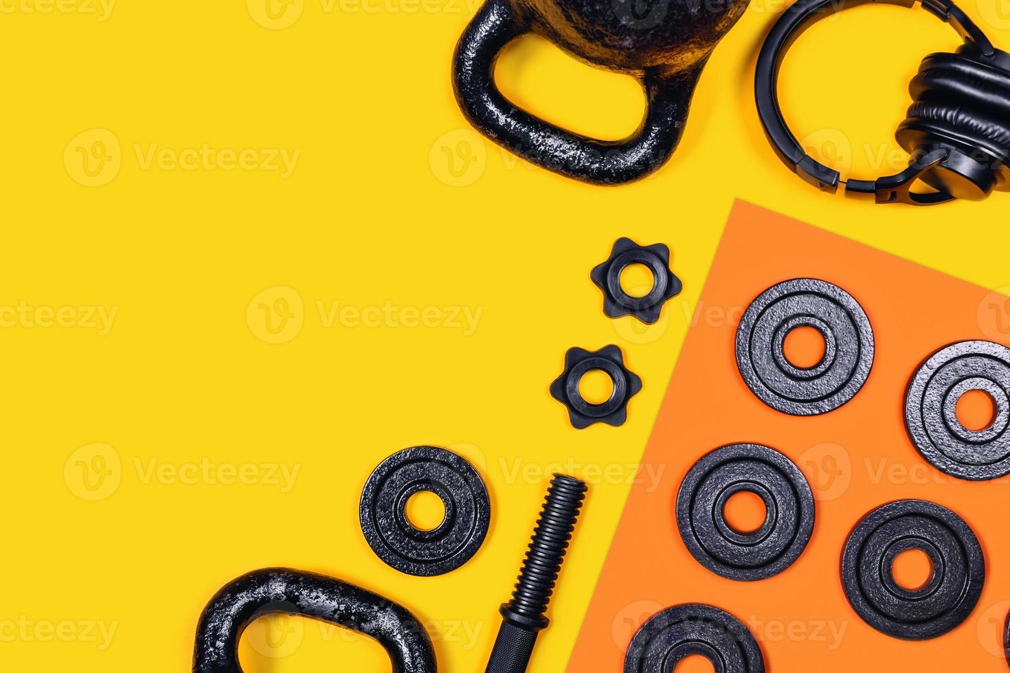 Kettlebells and dumbbells on color background. photo