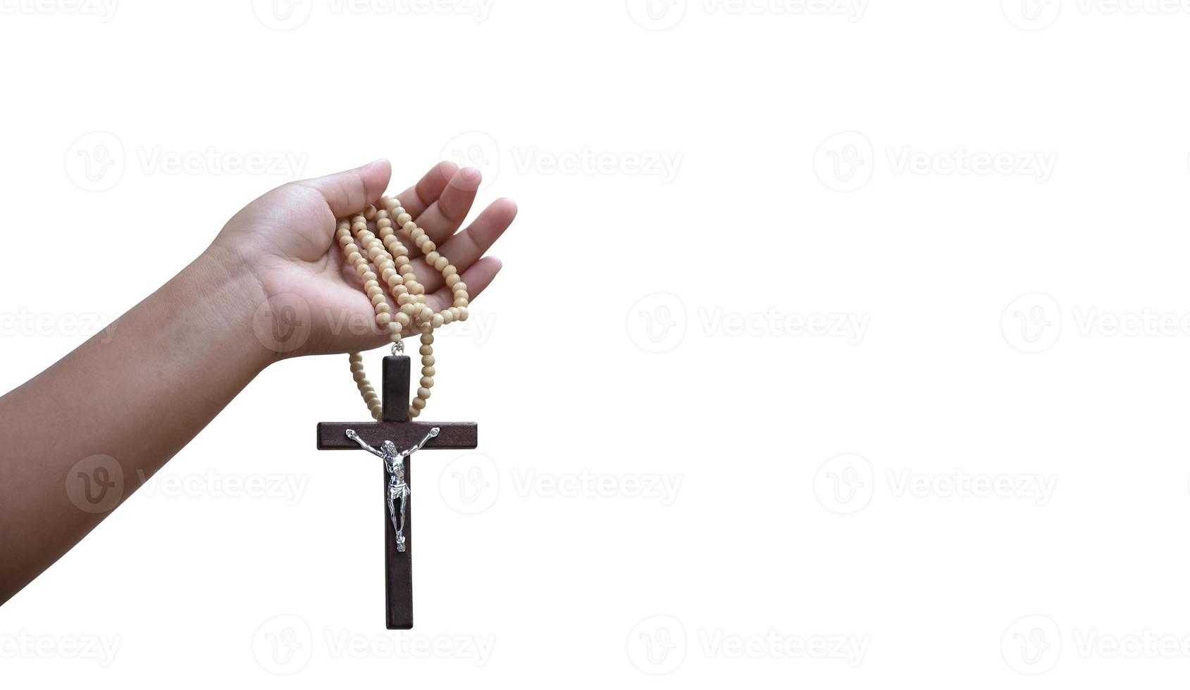 Isolated hand holding rosary and cross with clipping paths. photo