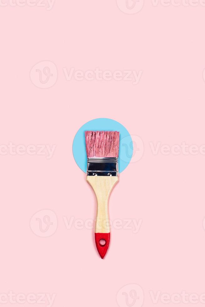 Color background with pink paint brush. photo