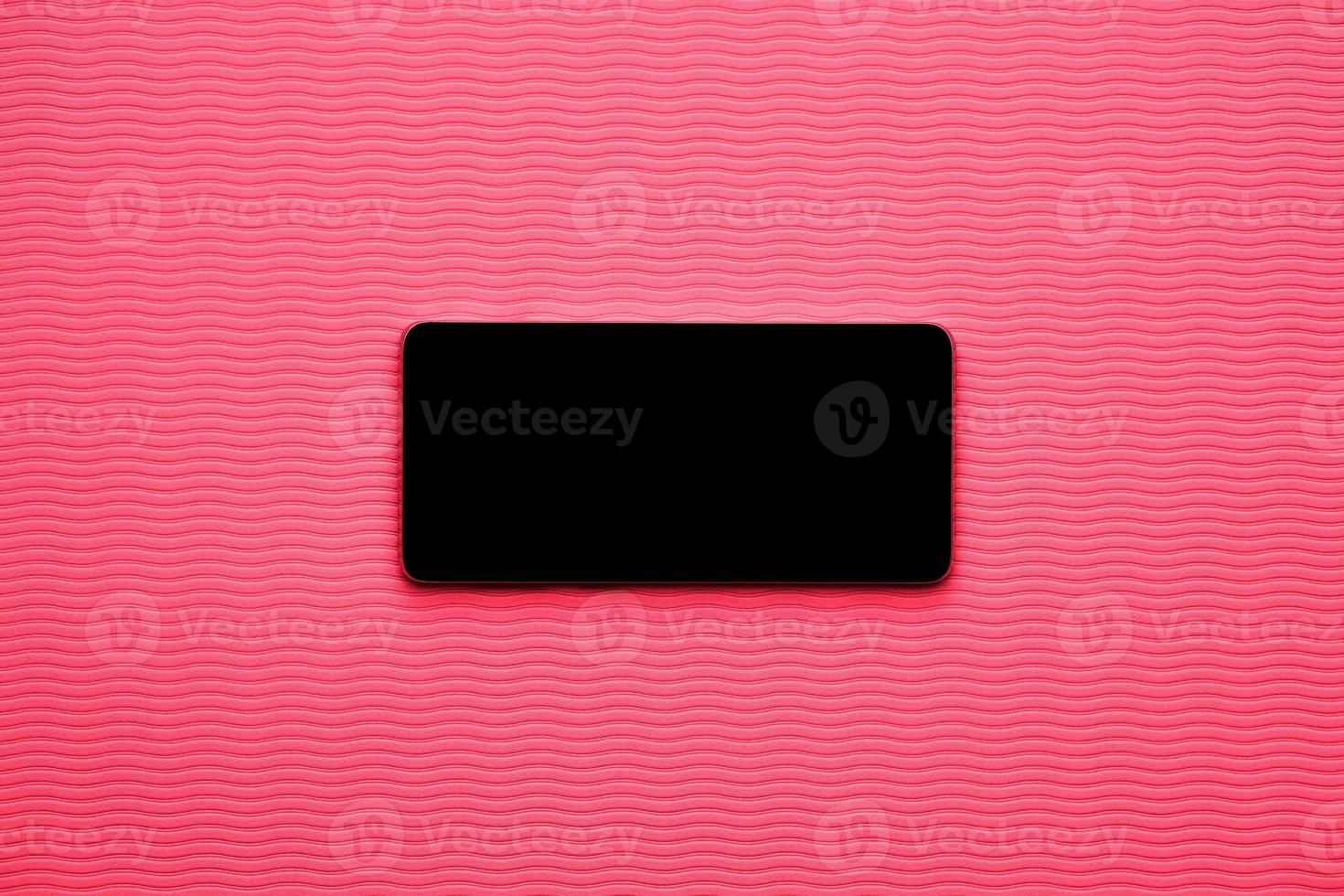Horizontal blank phone on magenta wave background photo
