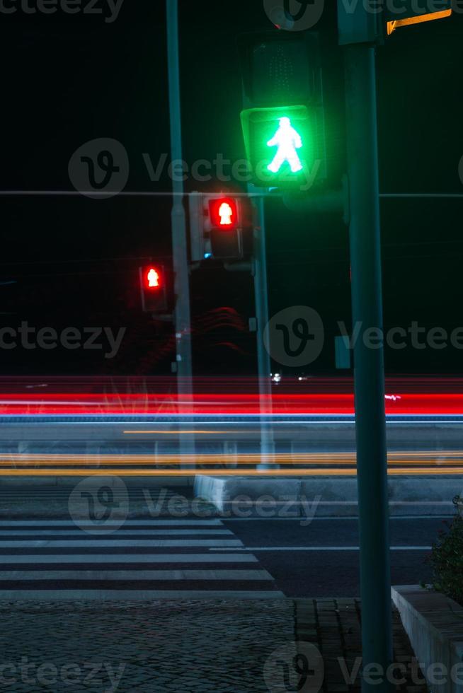 Red and Green pedestrian Crossing Signal On photo