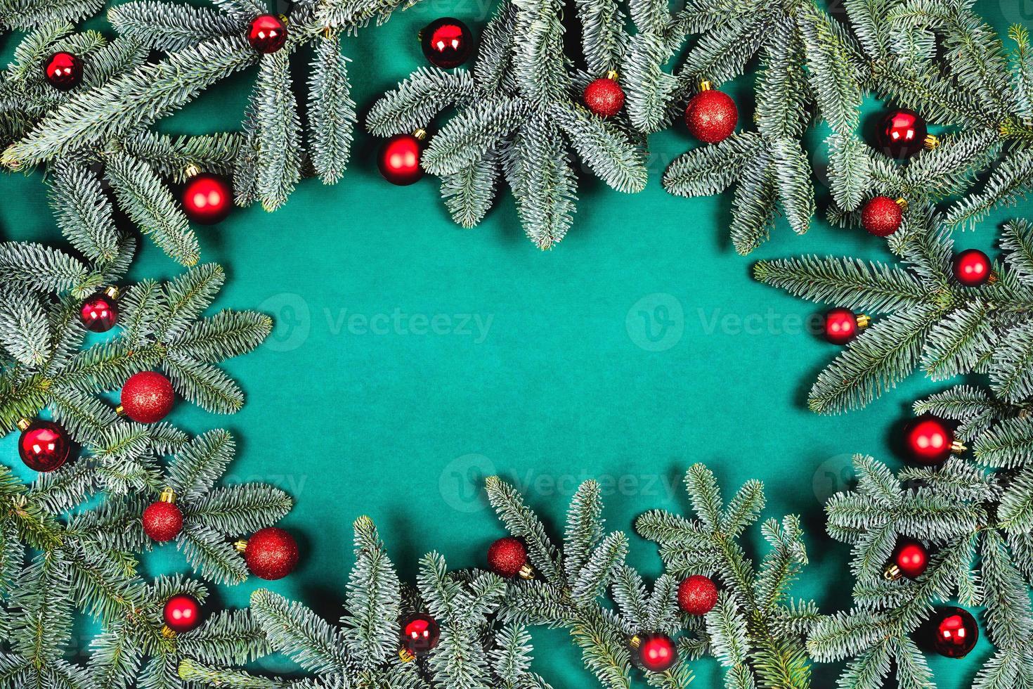 Christmas background with fir branches and red balls. photo