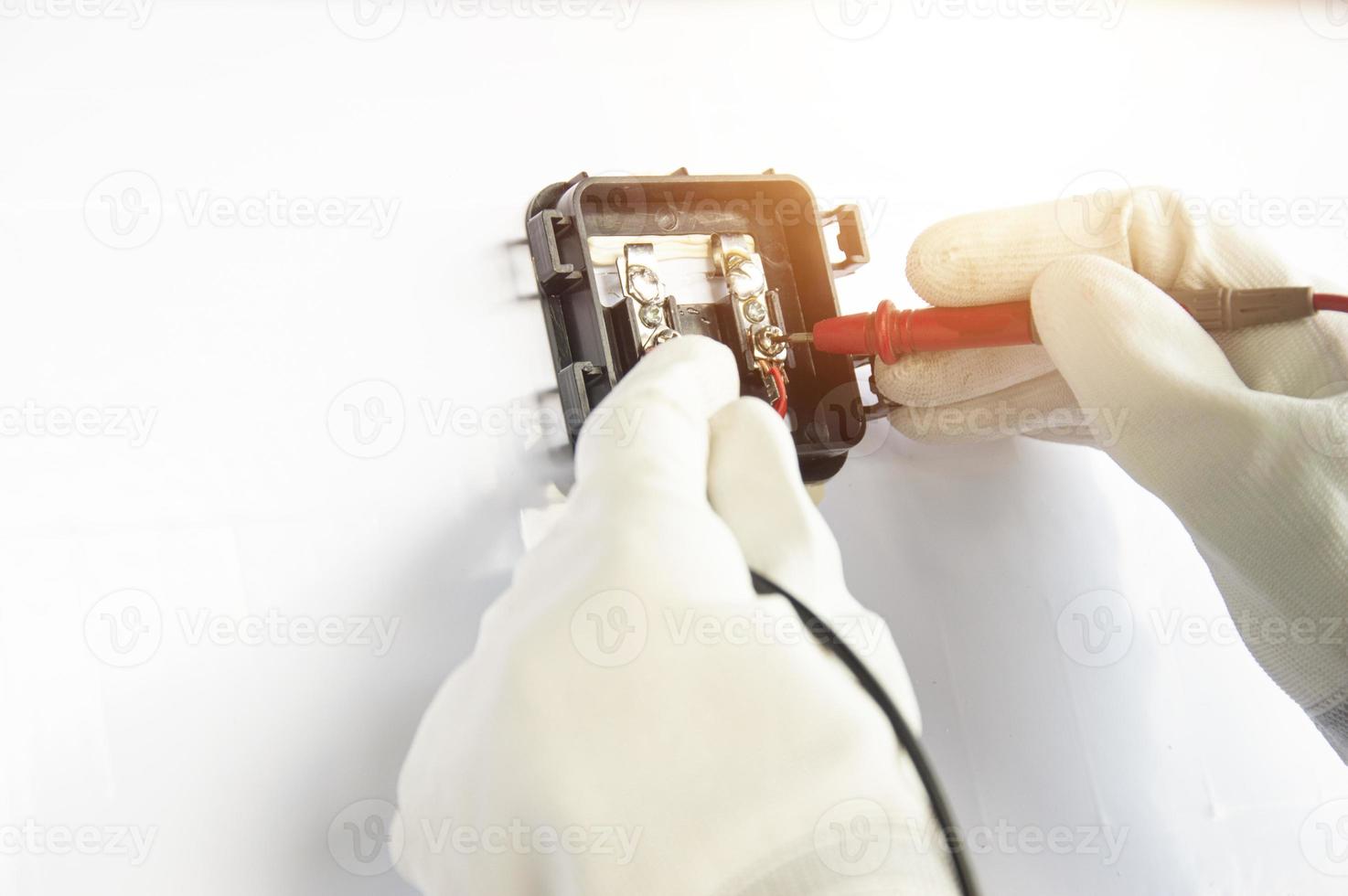 Technicians are connecting wires to solar panels. photo