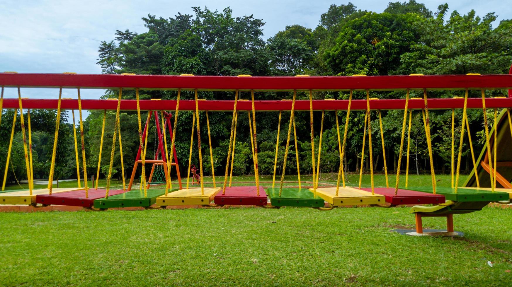 colorful bridge on children's playground, outdoor recreation photo