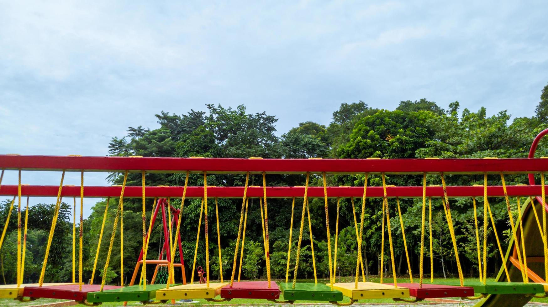 colorful bridge on children's playground, outdoor recreation photo