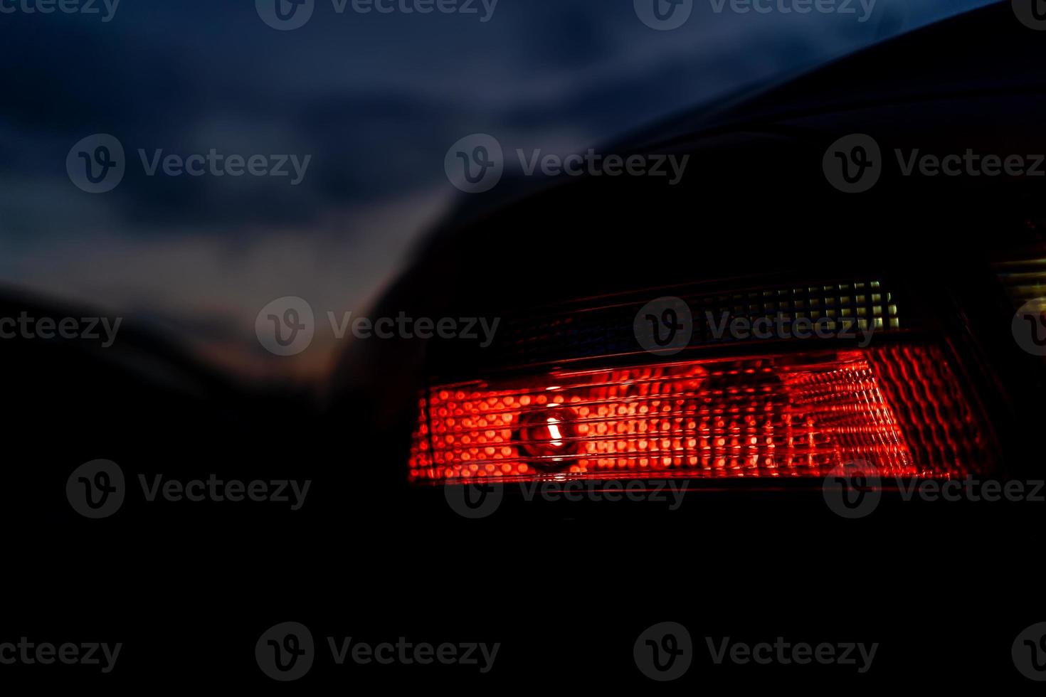 car tail light at night close up photo