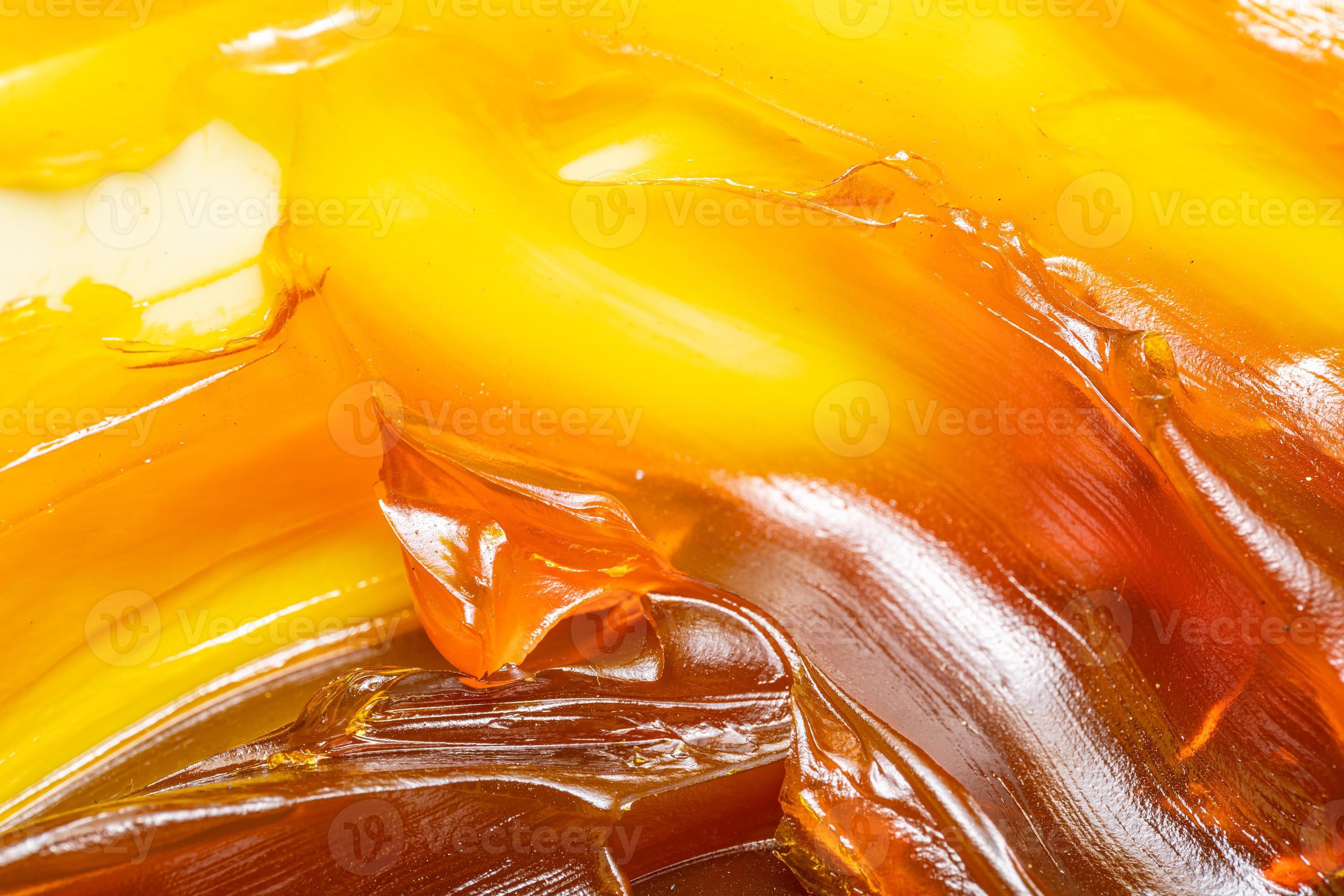 Close up of orange colored industrial grease. Rich and thick texture of