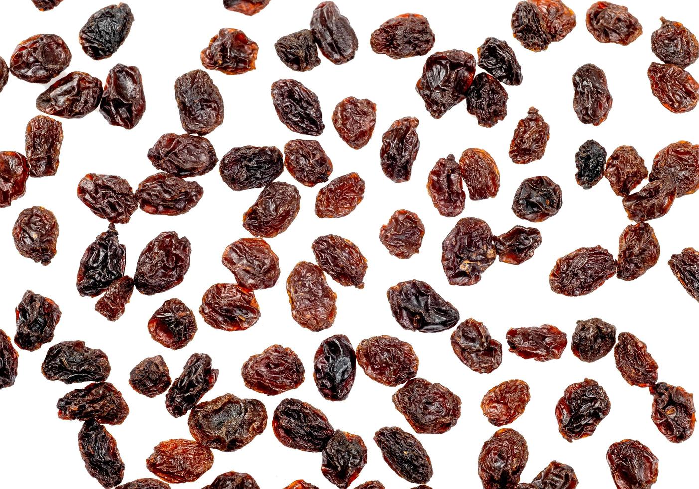 Top view of dried raisins isolated on white background with clipping pate photo