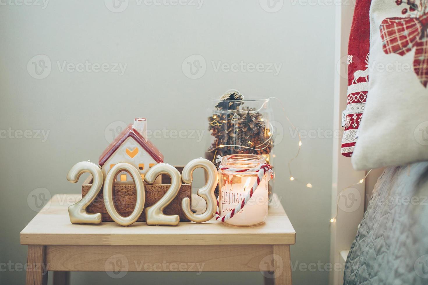 Numbers 2023 on with festive Christmas decor. Happy New Year 2023. Copy space photo