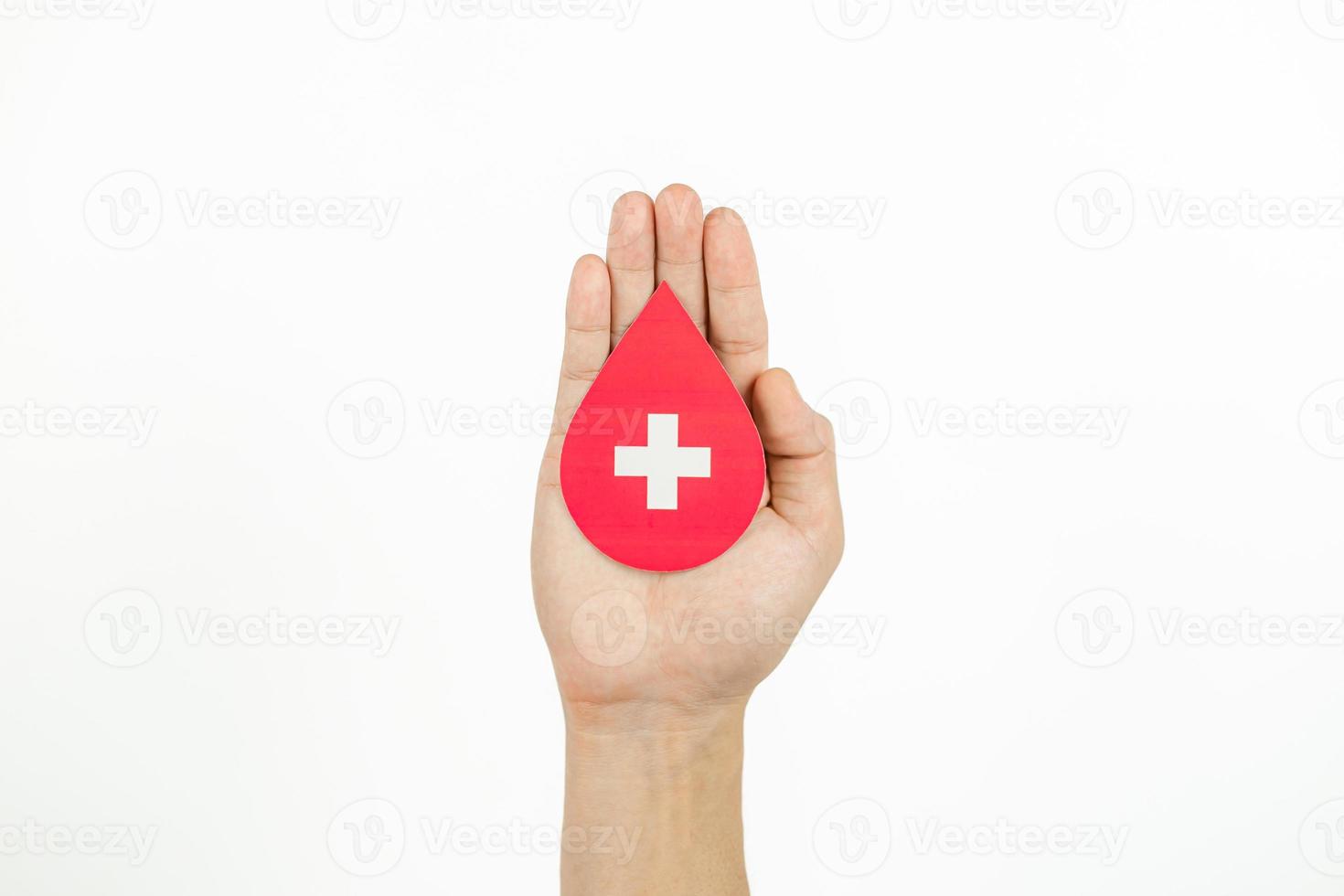 Hands holding blood drop paper cut on white background, Blood transfusion, World blood donor day. Blood Donation and Saving life Concept photo