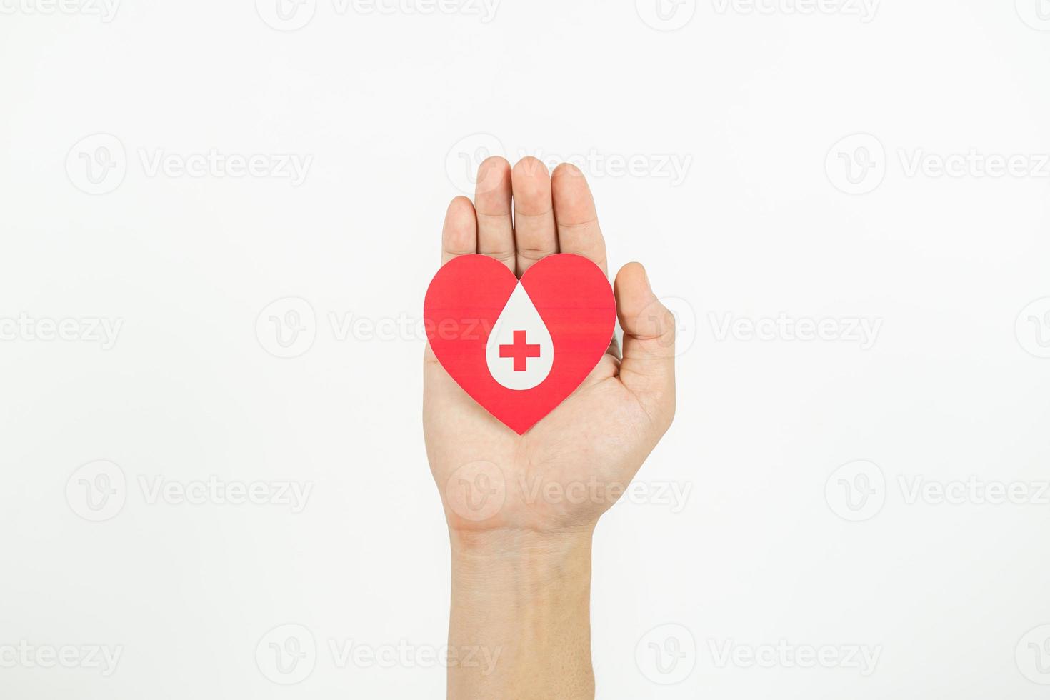 Hands holding heart for giving life paper cut on white background, Blood transfusion, World blood donor day. Blood Donation Concept photo