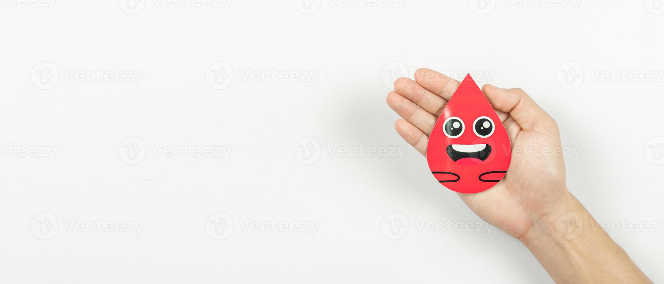 Hands holding blood drop paper cut on white background, Blood transfusion, World blood donor day. Blood Donation and Saving life Concept photo