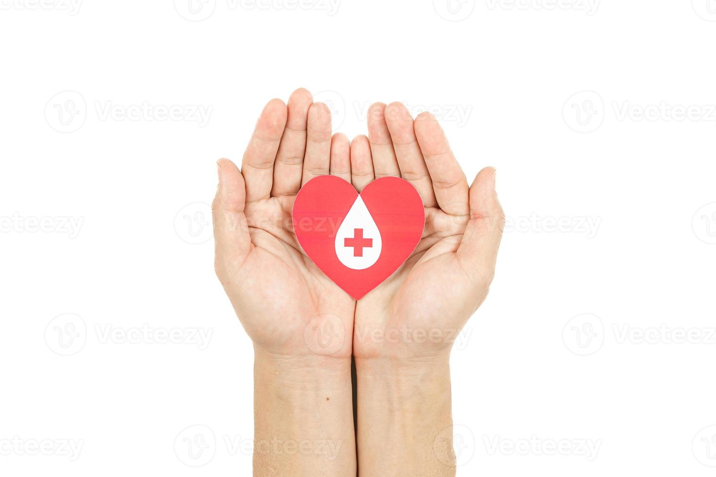 Hands holding blood drop paper cut on white background, Blood transfusion, World blood donor day. Blood Donation and Saving life Concept photo