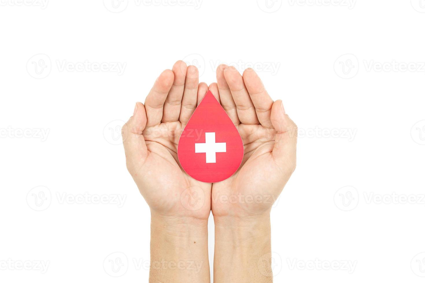 Hands holding blood drop paper cut on white background, Blood transfusion, World blood donor day. Blood Donation and Saving life Concept photo