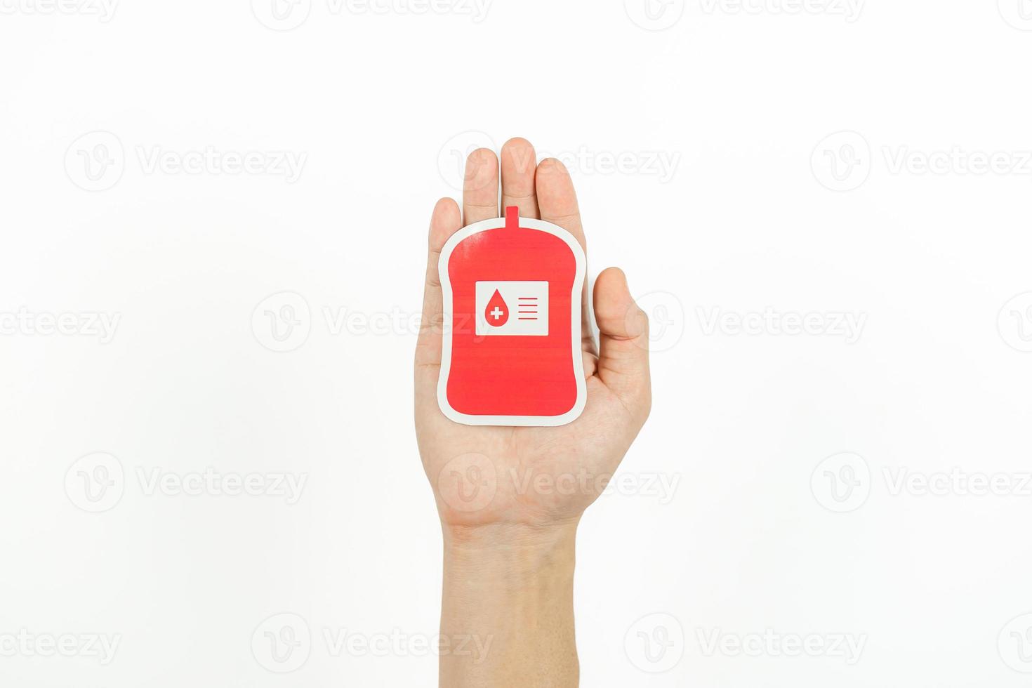 Hands holding blood pack paper cut on white background, Blood transfusion, World blood donor day. Blood Donation and Saving life Concept photo