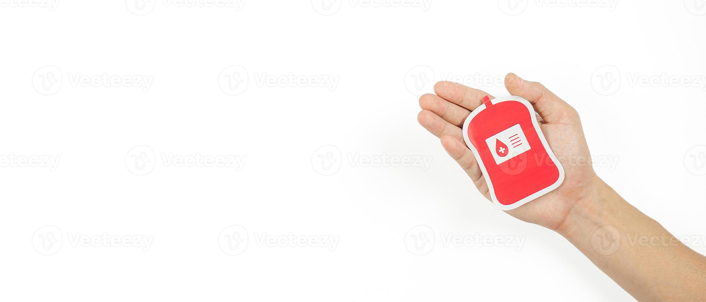 Hands holding blood pack paper cut on white background, Blood transfusion, World blood donor day. Blood Donation and Saving life Concept photo