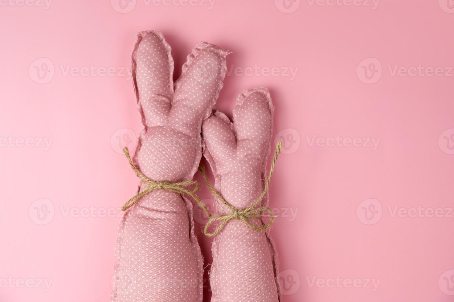 Top view.Monochrome pink easter banner with bunnies. Place for text.Flat lay photo