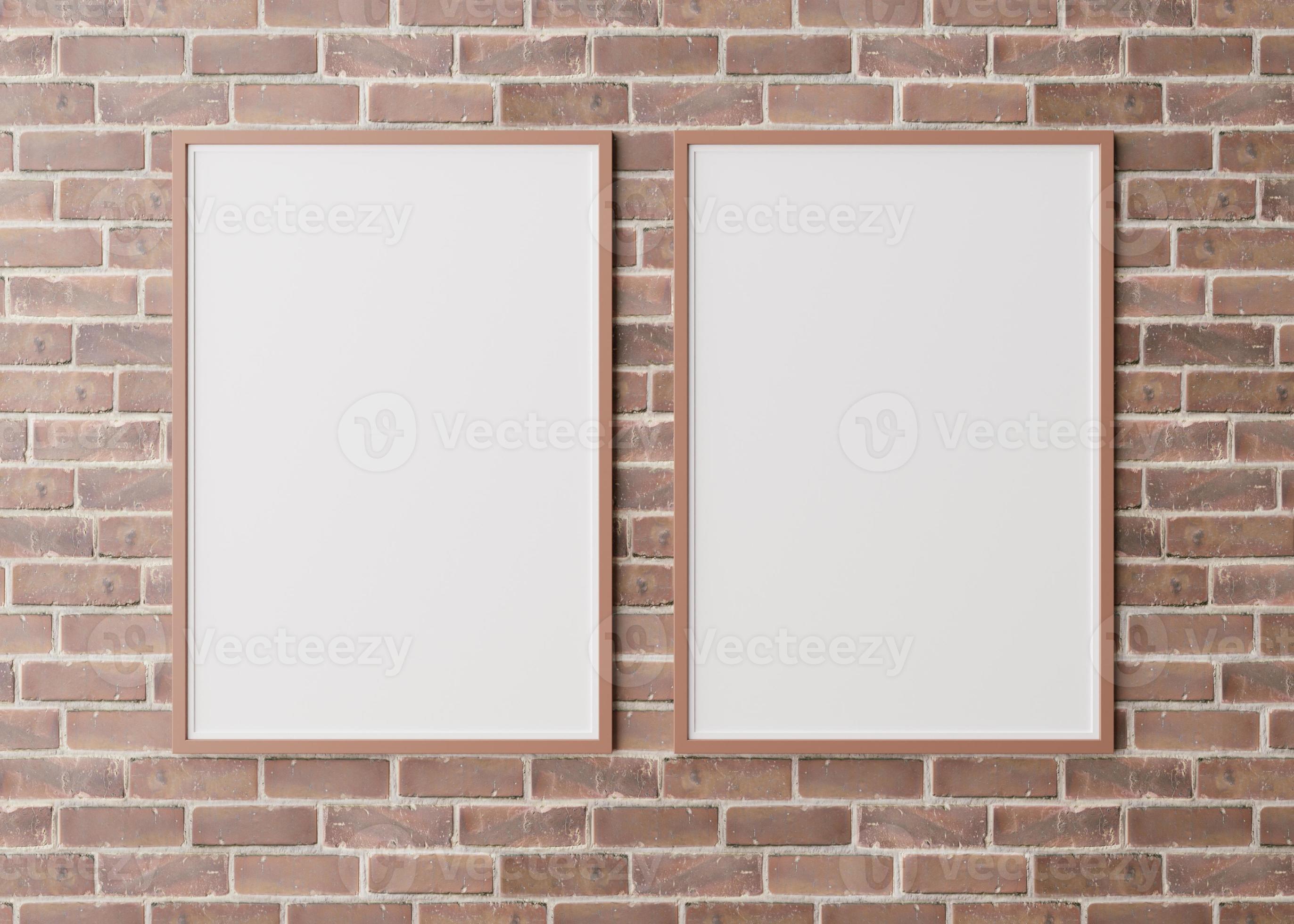 Two blank vertical picture frames hanging on brown brick wall. Template, mock up for your