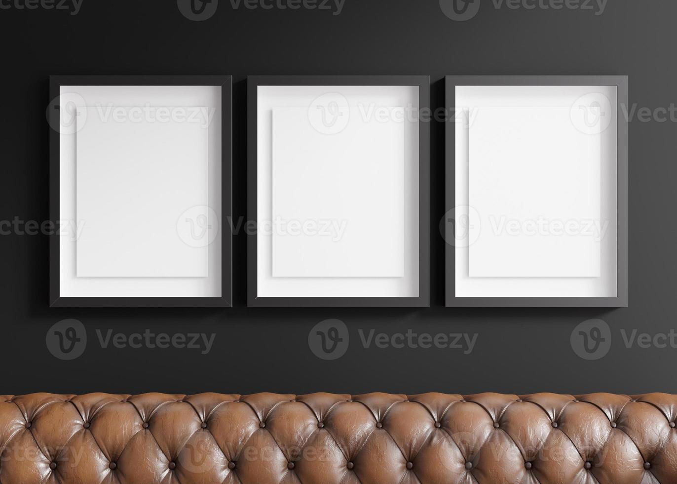 Three blank vertical picture frames hanging on black wall. Template, mock up for artwork, picture or poster. Empty, copy space. Close up view. Simple, minimalist mockup. 3D rendering. photo