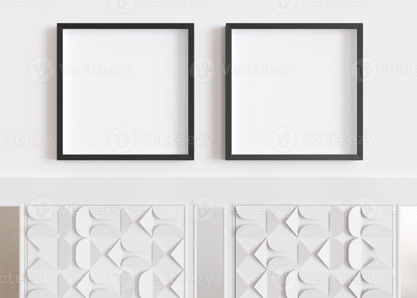 Two blank square picture frames hanging on white wall. Template, mock up for artwork, picture or poster. Empty, copy space. Close up view. Simple, minimalist mockup. 3D rendering. photo