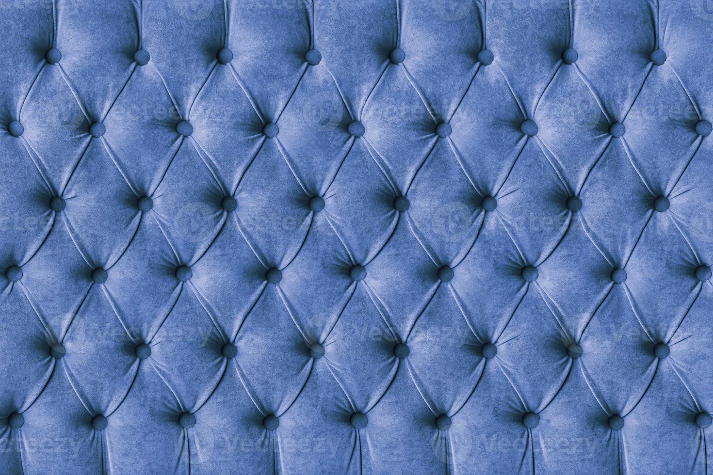 Blue capitone velours textile decoration with buttons photo