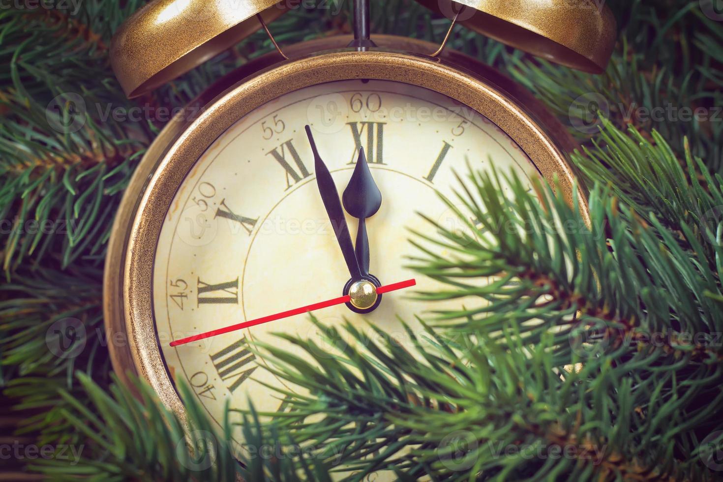 Christmas clock and fir branches photo