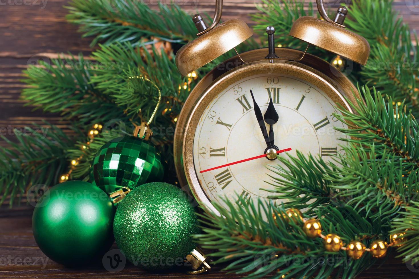 Christmas clock and fir branches photo
