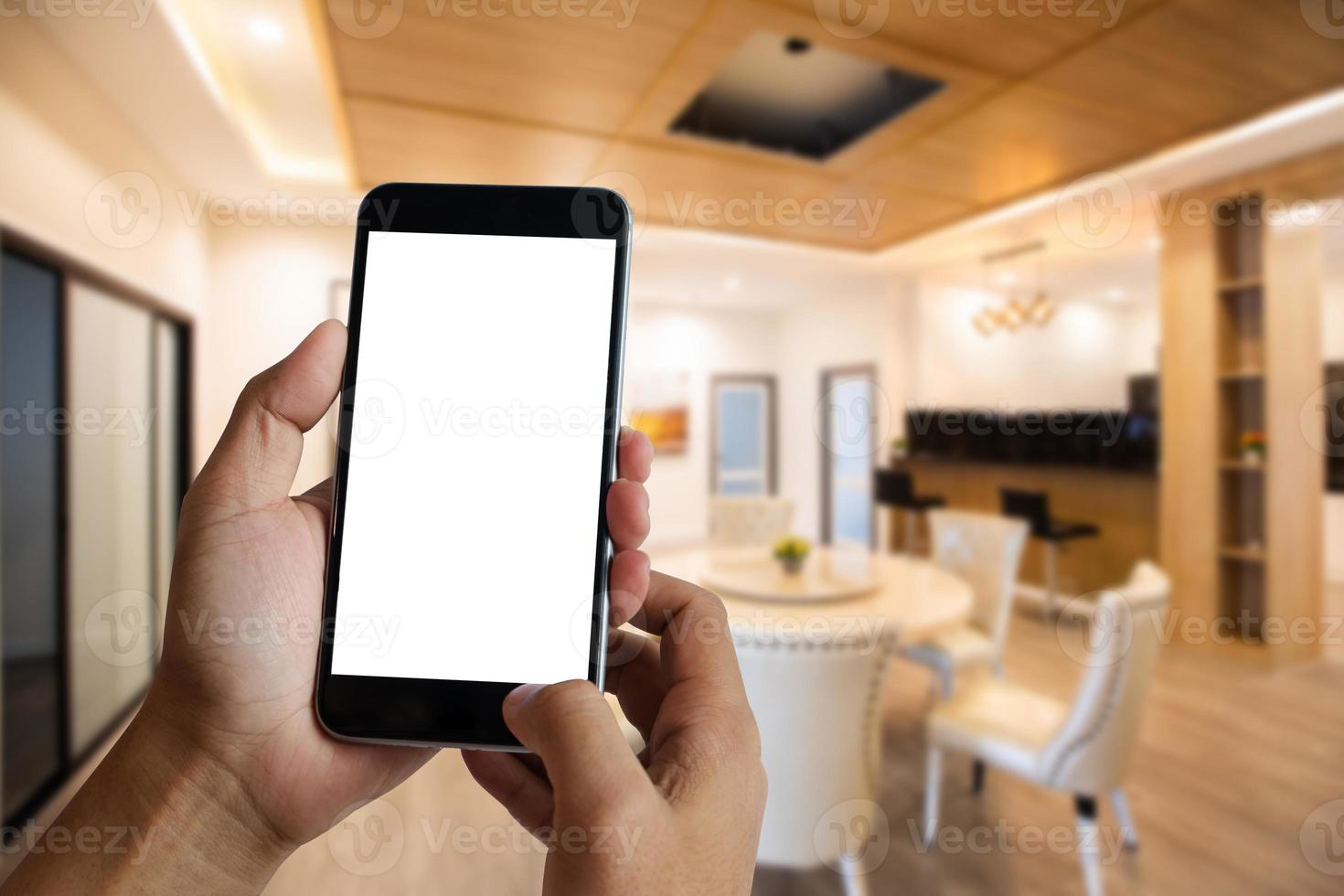 A woman hand holding smart phone device in the coffee shop photo