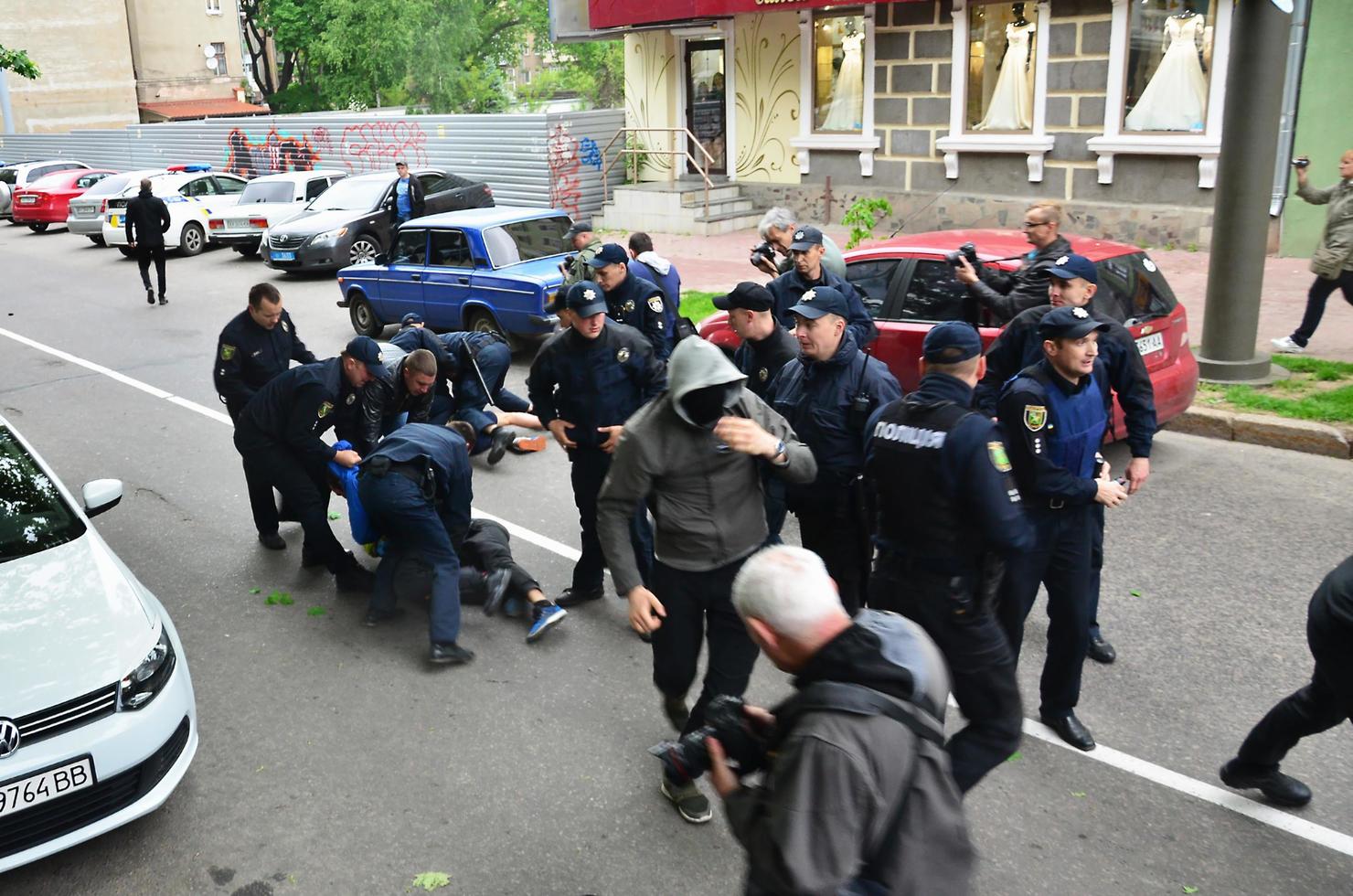 KHARKOV, UKRAINE - MAY 17, 2017 Blocking of exit to police cars by Kharkiv right-wing activists during the breakdown of the LGBT rally in Kharkov photo