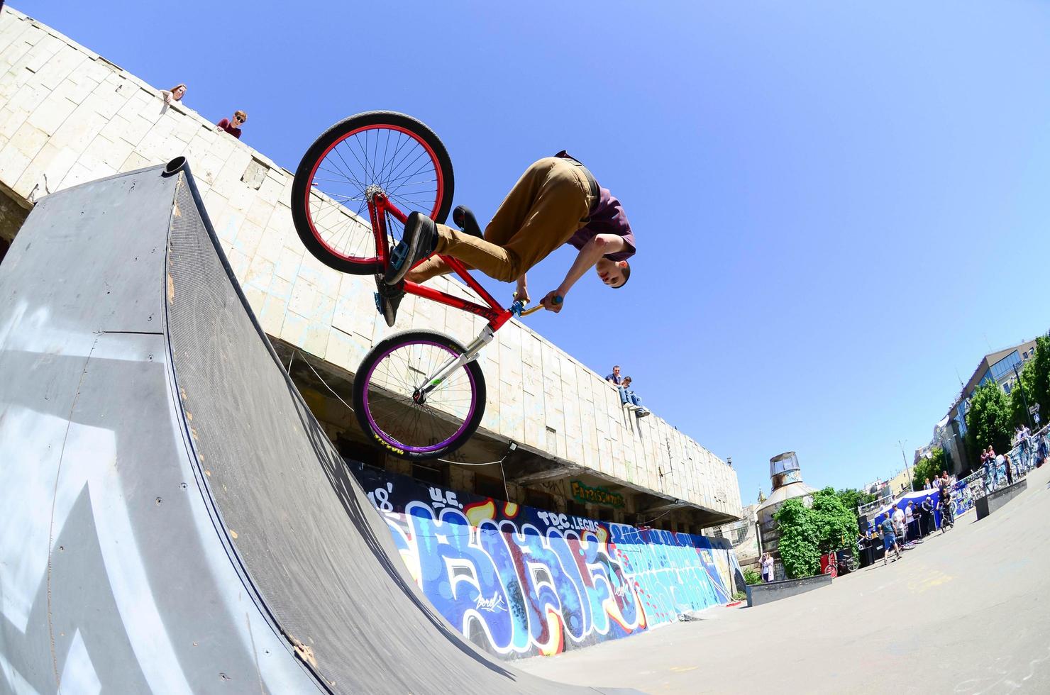 KHARKIV, UKRAINE - 27 MAY, 2018 Freestyle BMX riders in a skatepark during the annual festival of street cultures photo