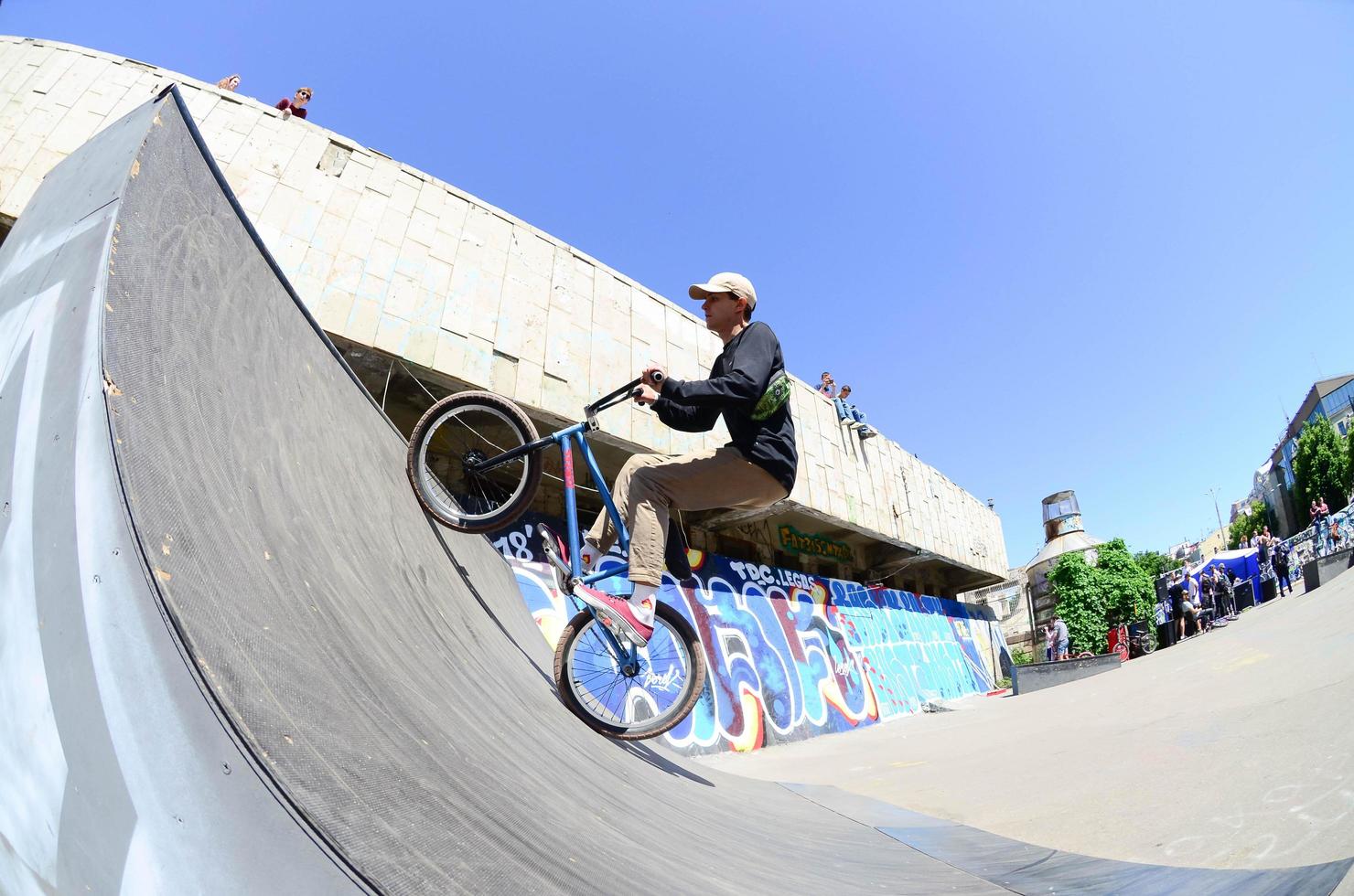 KHARKIV, UKRAINE - 27 MAY, 2018 Freestyle BMX riders in a skatepark during the annual festival of street cultures photo