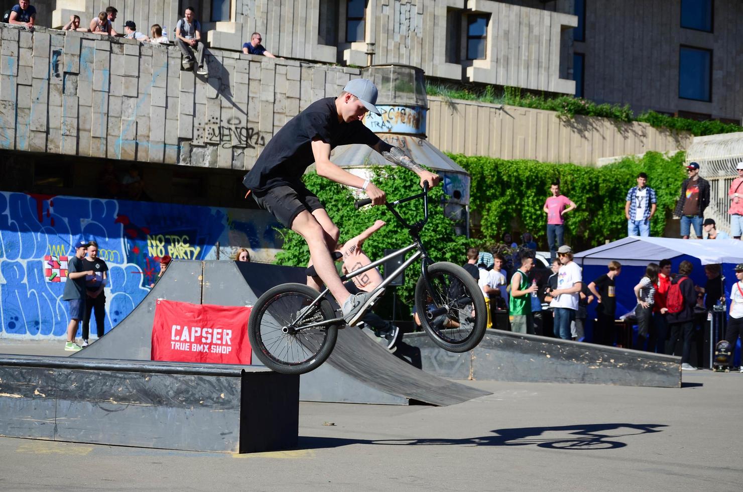 KHARKIV, UKRAINE - 27 MAY, 2018 Freestyle BMX riders in a skatepark during the annual festival of street cultures photo