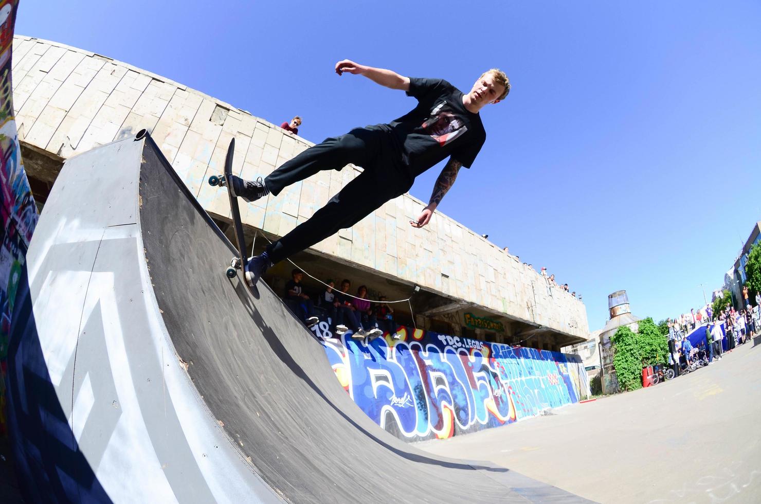KHARKIV, UKRAINE - 27 MAY, 2018 Skateboarding contest in outdoors skate park during the annual festival of street cultures photo