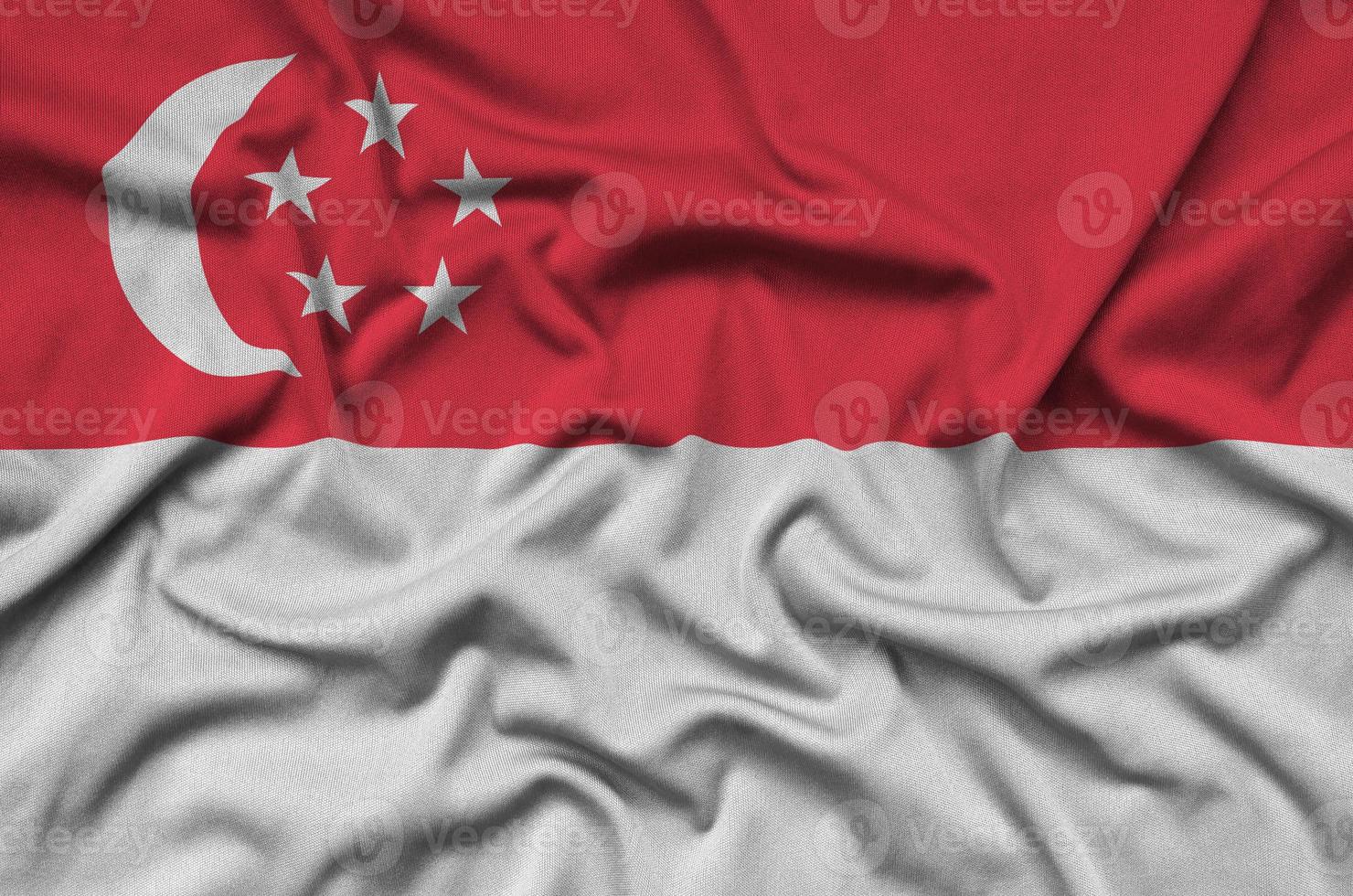 Singapore flag  is depicted on a sports cloth fabric with many folds. Sport team banner photo