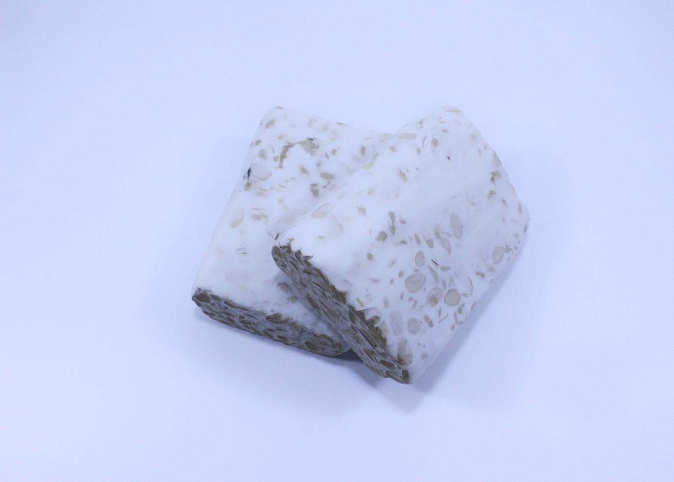 High Angle View Of Tempeh isolated on white background photo