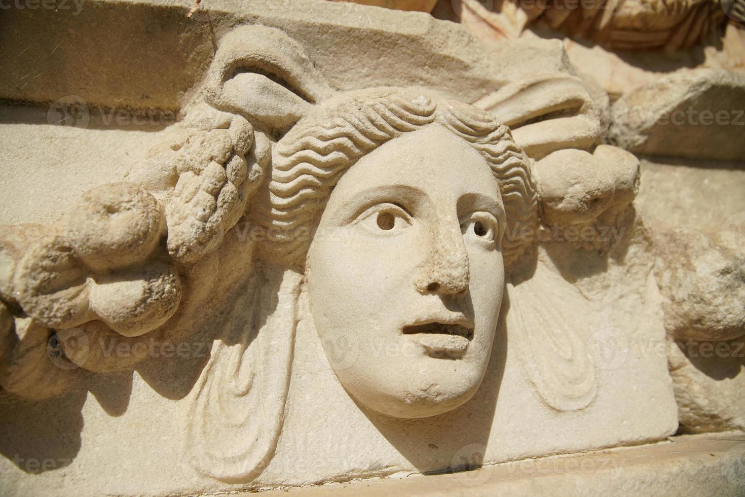 Ancient Mask Relief in Aphrodisias Ancient City in Aydin, Turkiye photo