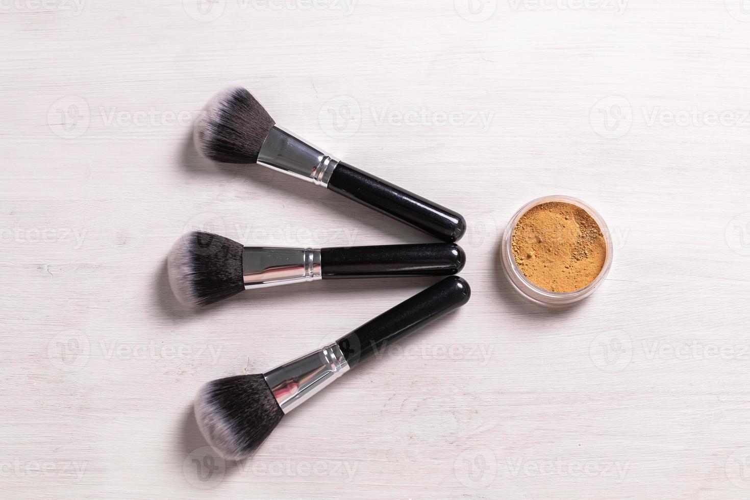 Mineral face powder and brush. Eco-friendly and organic beauty products photo