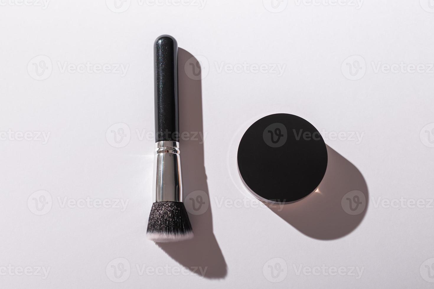 Mineral face powder and brush. Eco-friendly and organic beauty products photo