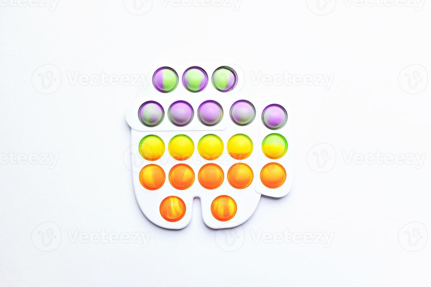 Pop it fidget toy. Multi-colored anti-stress toy with a wing shape on a white background photo