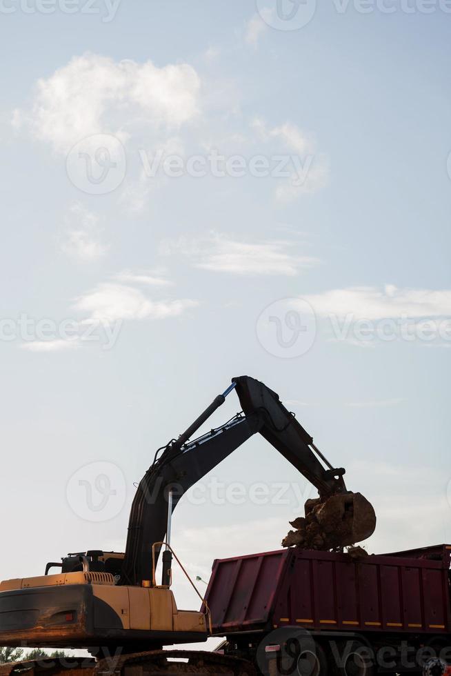 modern excavator performs excavation work photo