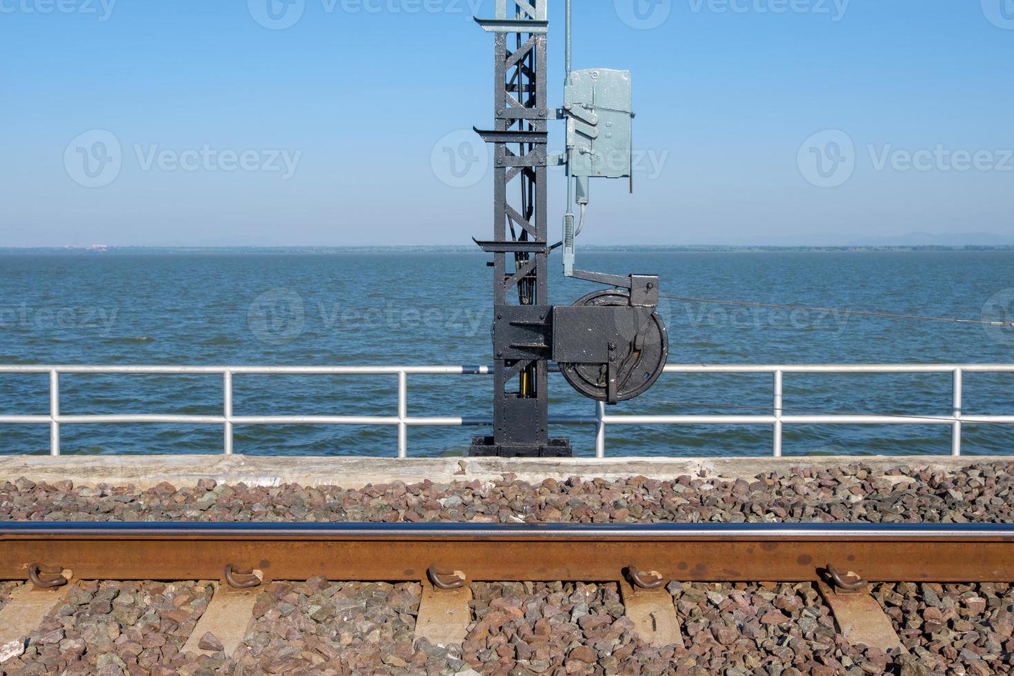 The wire control wheel of the signal post in the railway bridge. photo