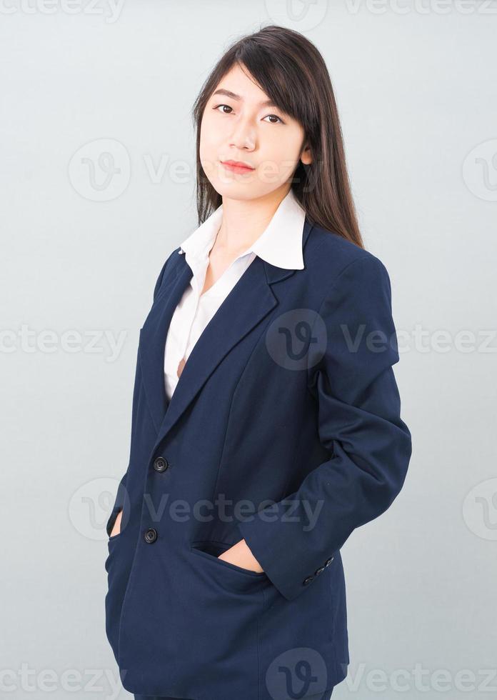 Portrait of asian businesswoman isolated on gray photo