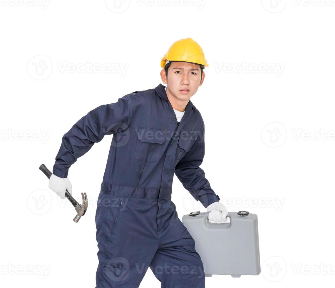 Young handyman  standing with his tool box photo