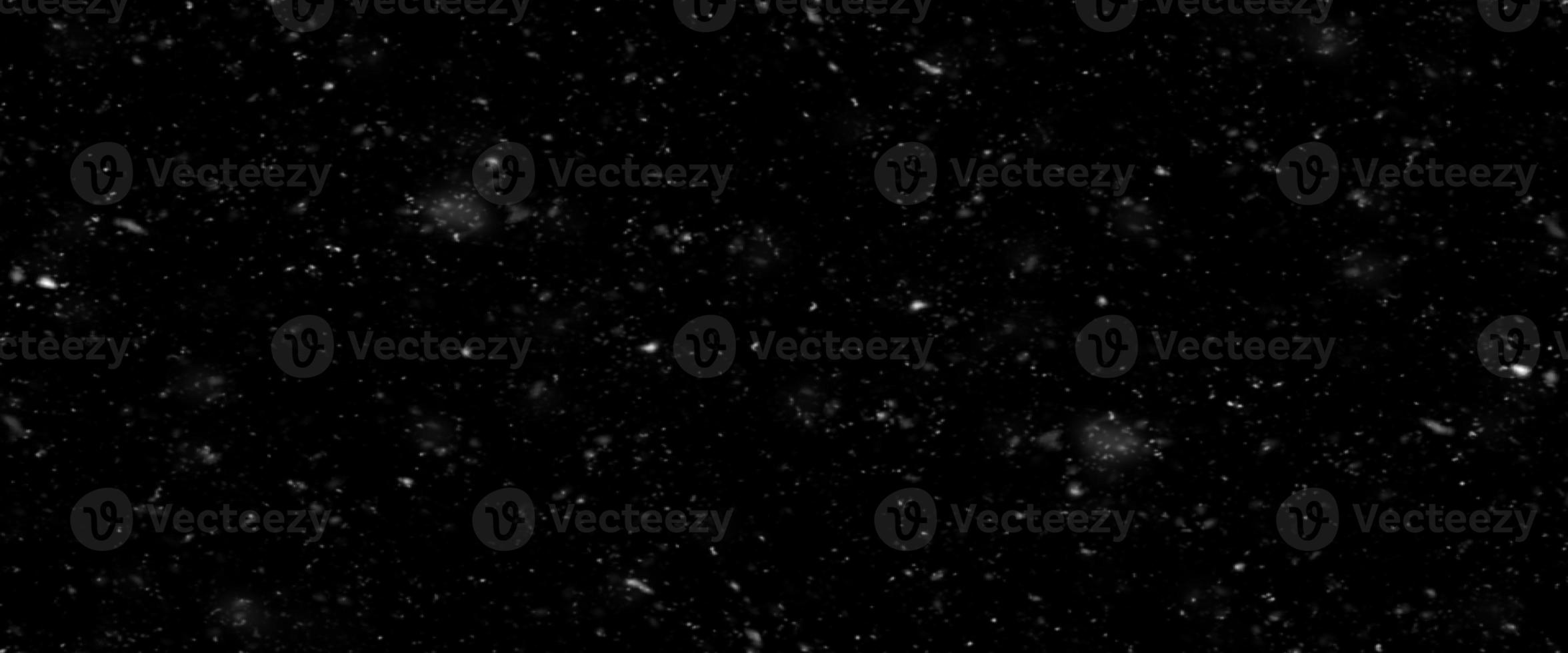 Falling snow flakes, Flying dust particles on a black background. Abstract winter background. Winter landscape with falling shining beautiful snow. photo