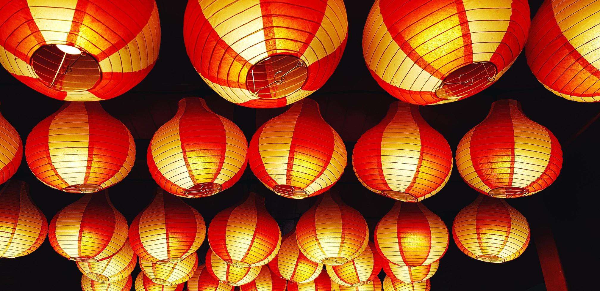 Beautiful red Chinese lantern decorating and hanging on ceiling at China temple, Singapore. Object for decoration on festival or celebration. photo